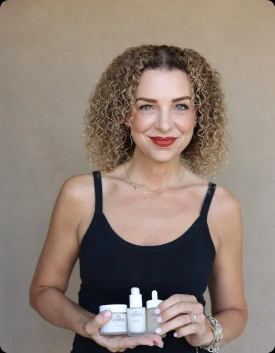 Jimi Sturgeon-Smith holding three Livyond products