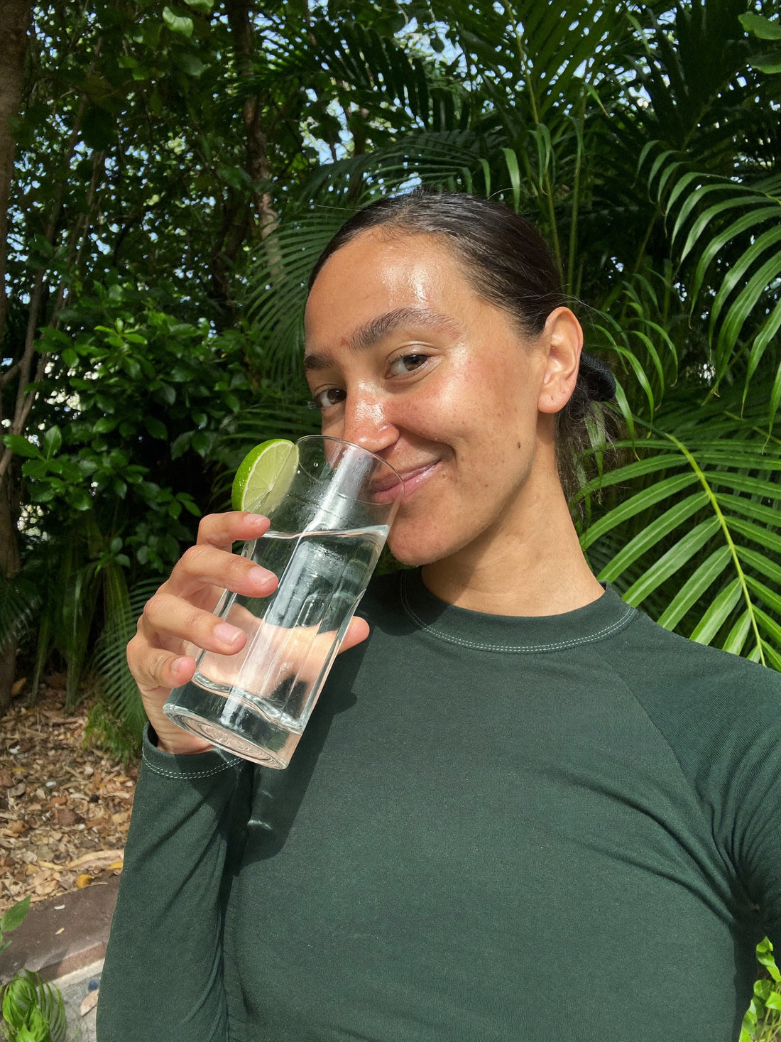 Drinking a glass of iced lime water after a run
