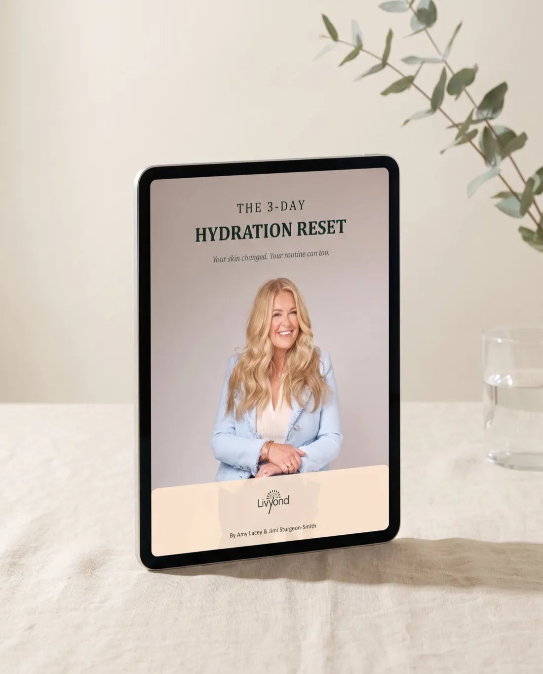 The 3-Day Hydration Reset ebook shown on a tablet standing on a linen table